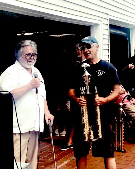 Dick Shappy presenting Best Of Show (Cadillac) trophy to Mike Goldbladt from Norwich Connecticut for his 1927 Cadillac Convertible Coupe